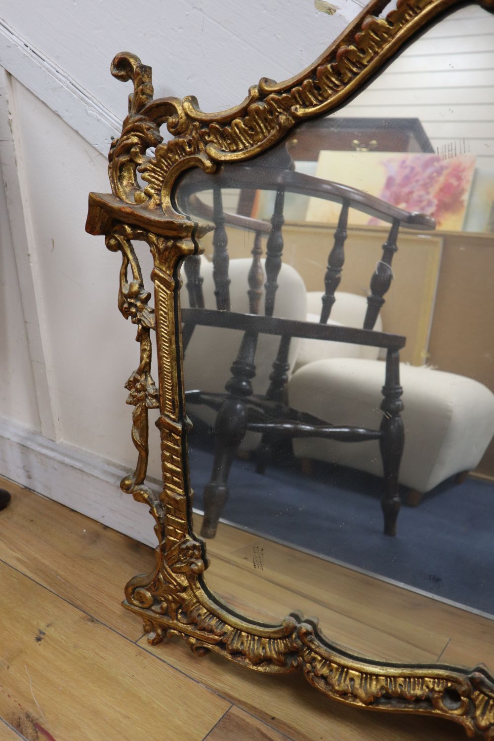 A gilt frame cartouche shaped wall mirror, width 112cm height 98cm